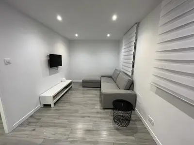 a living room with a couch and a tv at Vivienda turística Ares in Ares