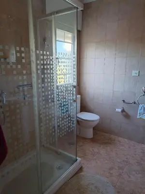 a bathroom with a shower and a toilet at Casa Macías in Lago de Carucedo