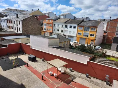 an overhead view of a city with buildings at SayCa CREDENCIAL in Sarria