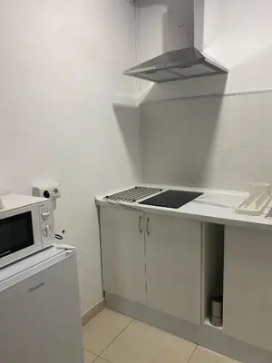 a kitchen with a stove and a microwave at Casa Trasande in Couso