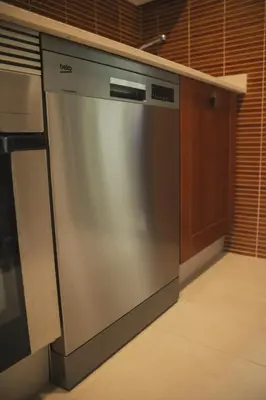 a stainless steel dishwasher in a kitchen at Apartamento Casco Histórico in Viveiro
