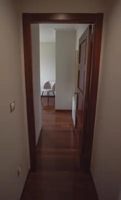 a hallway with an open door to a room at Apartamento Casco Histórico in Viveiro