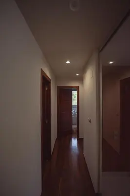 an empty room with a hallway with a door at Apartamento Casco Histórico in Viveiro