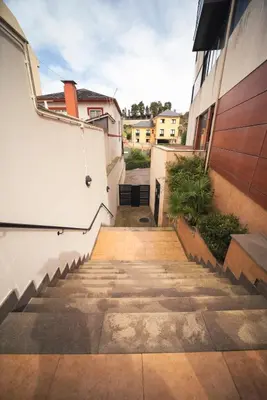a stairway leading up to a building at Apartamento Casco Histórico in Viveiro