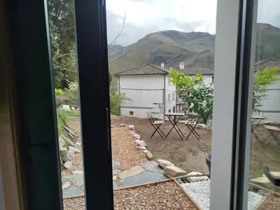 a view from the window of a house at Hotel Zura in Seoane