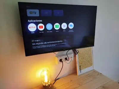 a flat screen tv sitting on top of a table at Hotel Zura in Seoane