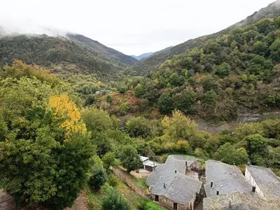 an aerial view of a house in the mountains at Hotel Zura in Seoane