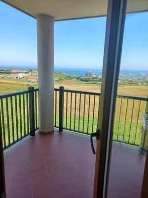 a balcony with a view of the ocean at Praia de llas in Foz