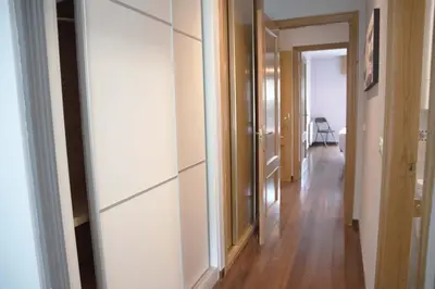 a room with a hallway with a mirror on the wall at Apartamento Mónaco in Santiago de Compostela
