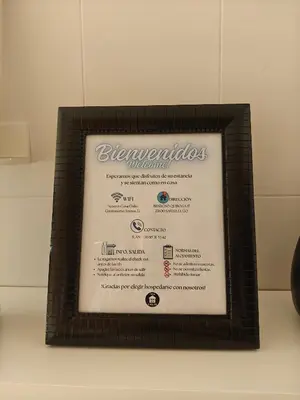 a picture of a menu in a frame on a table at Apartamento casa Chilin in Sarria