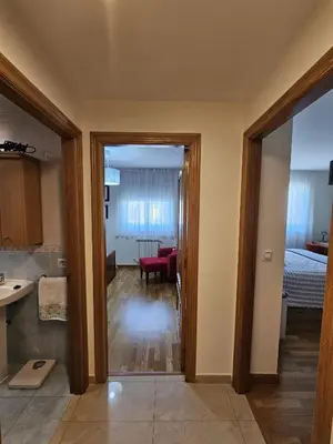 a view from the living room into the kitchen and living room at Apartamento casa Chilin in Sarria
