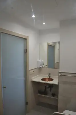 a bathroom with a sink and a mirror at Avío Apartamentos in Santiago de Compostela