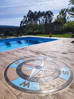 a swimming pool with a star design in the middle at Nuevo sabor rural Ribeira Sacra in A Pobra do Brollon