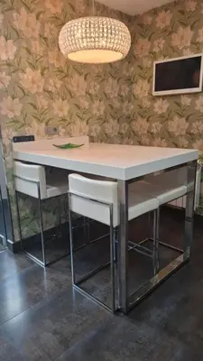 a dining table with two chairs and a light fixture at Duplex A Mosquera by Foroplaza Pleno centro Vistas muralla in Lugo