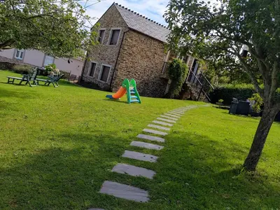 a garden with a pathway in the grass at Apartamentos A Palleira in Barreiros