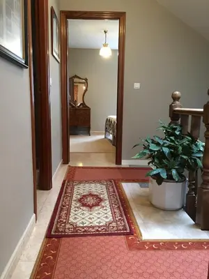 a hallway with a door and a rug on the floor at Tranquilidad cerca de playas y lugares históricos VUT-LU-00402 in Lourenzá