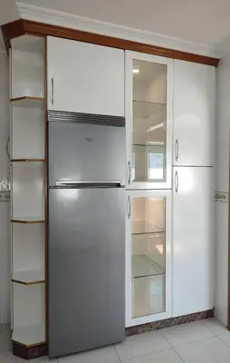 a kitchen with white cabinets and a refrigerator at Pensión Armonía in Caldas de Reis