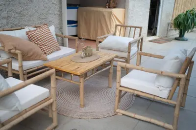 a group of chairs and a wooden table and chairs at Casa Milladoiro in Miño