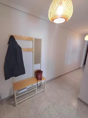 a dressing room with a bench and a mirror at Apartamento Camiño de Santiago in Sarria