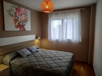 a bedroom with a bed and a window at El Valle in San Cosme de Barreiros