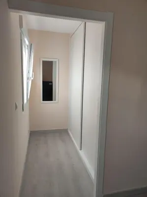 an empty hallway with a door to a room at Piso en Valadouro in Valle de Oro