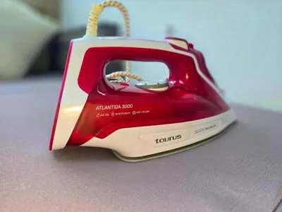 a red and white toaster sitting on a table at Loft Luxury in Caldas de Reis