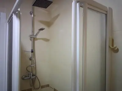 a shower in a bathroom with a shower curtain at Adrian in Arzúa