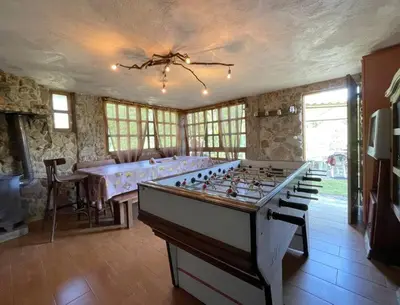 a large room with a large foosball table at Casa Aradiña in Santa María