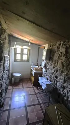 a room with a bathroom with a sink and a toilet at Casa Aradiña in Santa María