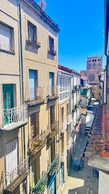 a view of a building with balconies on a street at Bulebule - Acogedor apartamento en pleno centro de Ourense in Ourense