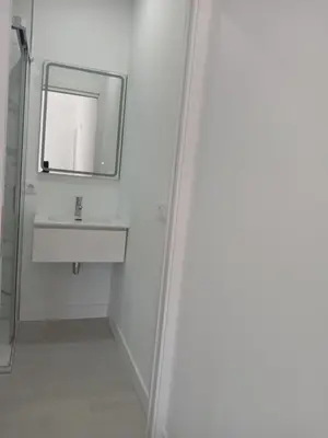 a bathroom with a sink and a mirror at Alojamiento FCB Rúa Nova in O Pedrouzo