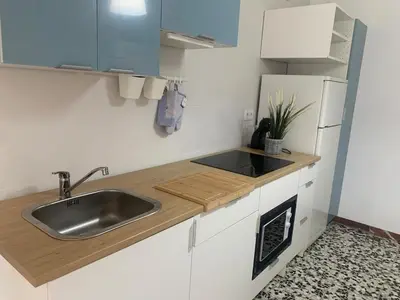 a kitchen with a sink and a refrigerator at Apartamento en Xinzo de Limia in Xinzo de Limia