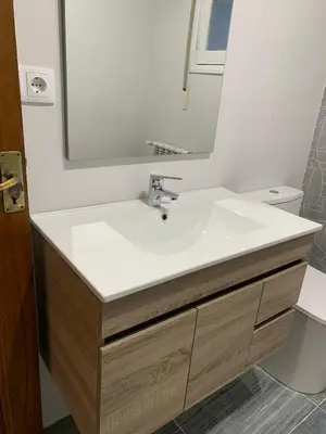 a bathroom with a white sink and a mirror at Apartamento en Xinzo de Limia in Xinzo de Limia