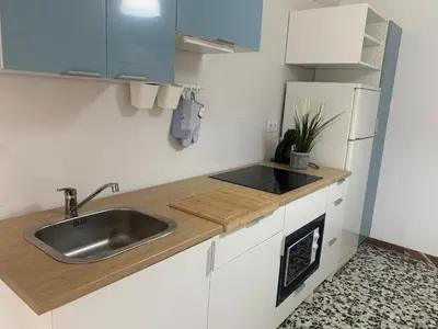 a kitchen with a sink and a refrigerator at Apartamento en Xinzo de Limia in Xinzo de Limia