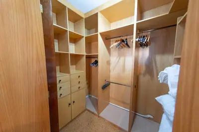 a walk in closet with a glass shower in a room at Duplex en Burela Mi Piso 90 in Burela de Cabo