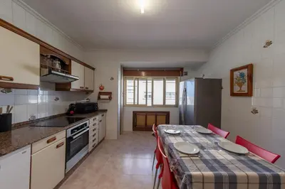 a kitchen with a table with a table cloth on it at Duplex en Burela Mi Piso 90 in Burela de Cabo