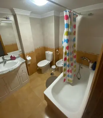 a bathroom with a tub and a sink and a toilet at Terra 3A in Caldas de Reis