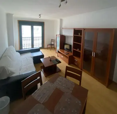 a living room with a couch and a table at Terra 3A in Caldas de Reis