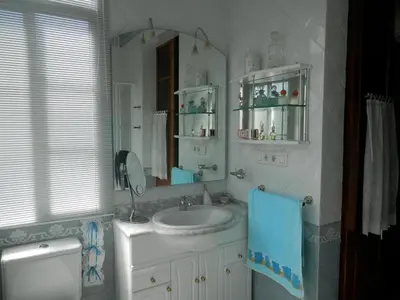 a bathroom with a sink and a mirror at Villa Andrade in Mor