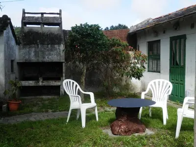 a group of chairs and a table in a yard at Villa Andrade in Mor