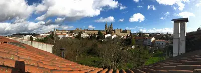 a view of a city from roofs of buildings at Hostal Costa Azul in Santiago de Compostela