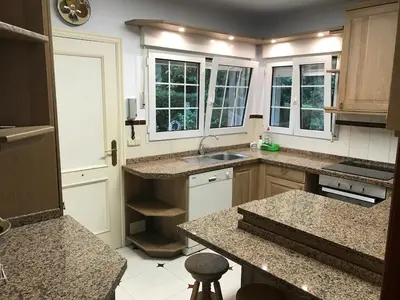 a kitchen with a sink and a counter top at Casa Pepe Albela - 20 min de Santiago in Santiago de Compostela