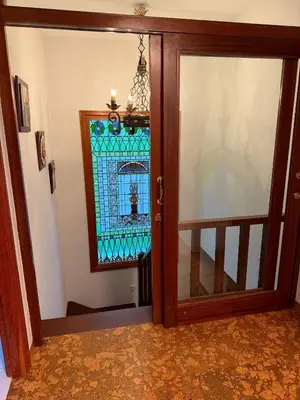 a glass door leading to aoyer with a staircase at Casa Pepe Albela - 20 min de Santiago in Santiago de Compostela