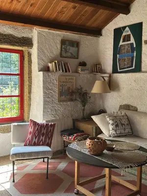 a living room with a couch and a table at O Freixo in A Capela