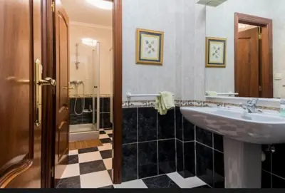 a bathroom with a sink and a shower at Los Cedros in Cabañas