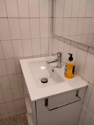 a bathroom with a white sink and a mirror at Casa rural con amplio terreno privado in Irijoa