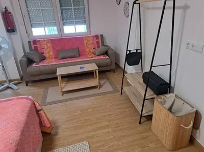 a living room with a couch and a table at Habitación privada en el mismo Camino de Santiago in Caldas de Reis