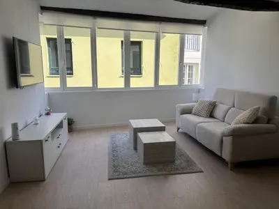 a living room with a couch and a coffee table at Tinería Lux in Lugo