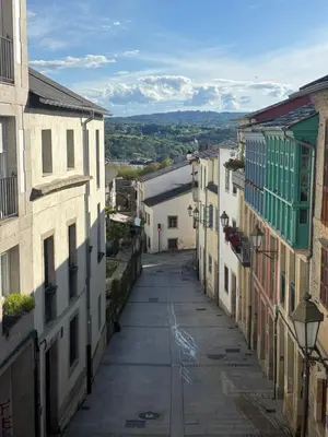 an alleyway between buildings in a town at Tinería Lux in Lugo