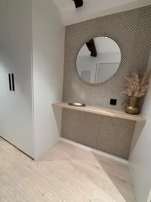 a bathroom with a mirror on the wall and a counter at Tinería Lux in Lugo